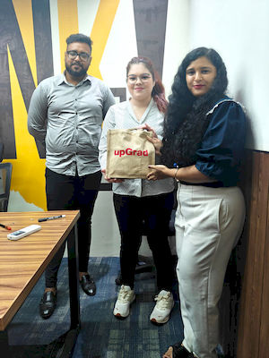 upGrad Kanpur office - student and parents with the counselling team after their study abroad session